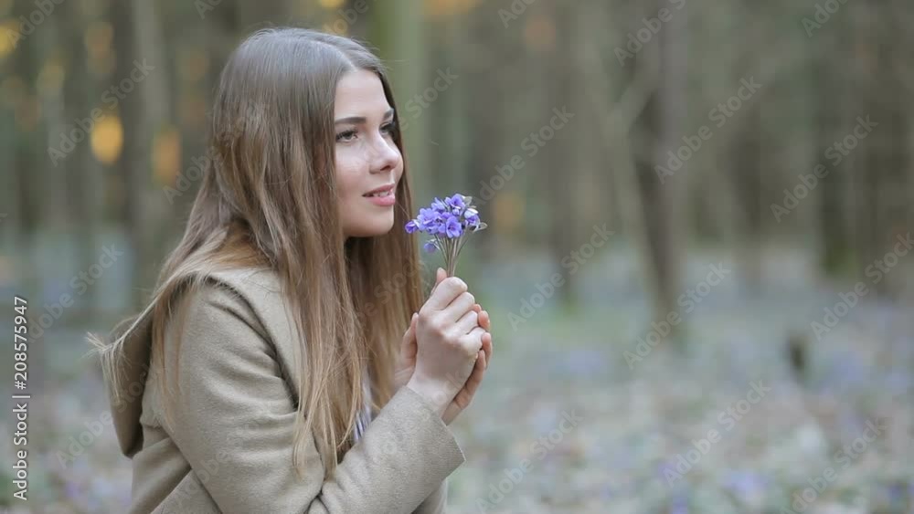 The girl in the Park admiring the snowdrops The girl in the Park admiring the snowdrops