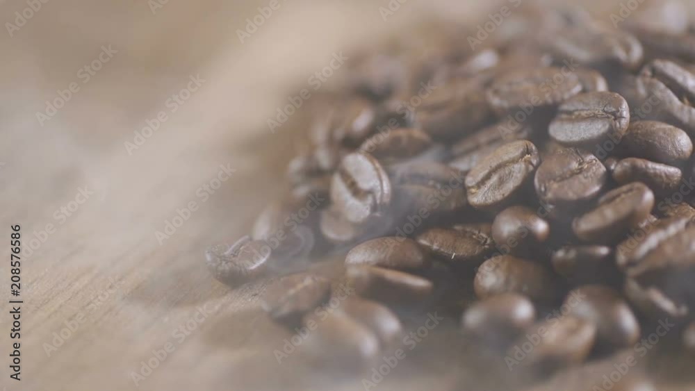 Coffee beans are loaded into the espresso machine for grinding. Closeup. Shallow depth of field Coffee beans are loaded into the espresso machine for grinding. Closeup. Shallow depth of field