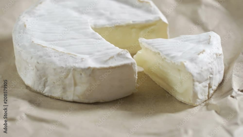 Portion of rotating creamy Camembert as detailed 4k footage Portion of rotating creamy Camembert as detailed 4k footage