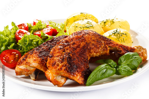 Roast chicken legs with boiled potatoes and vegetables