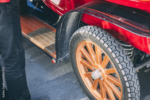 Detail of front vintage red vehicle wheels. Retro coach © Konstantin Savusia