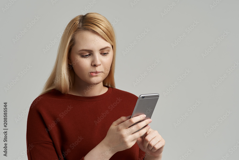 Dissatisfied frustrated woman to get a bill from the Bank service on mobile phone, has no money to pay. Dissatisfied frustrated woman to get a bill from the Bank service on mobile phone, has no money to pay.
