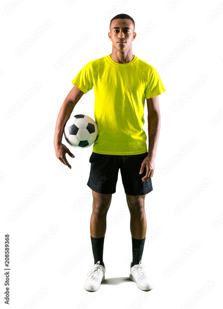 Soccer player man with dark skinned playing catching a ball with his hands