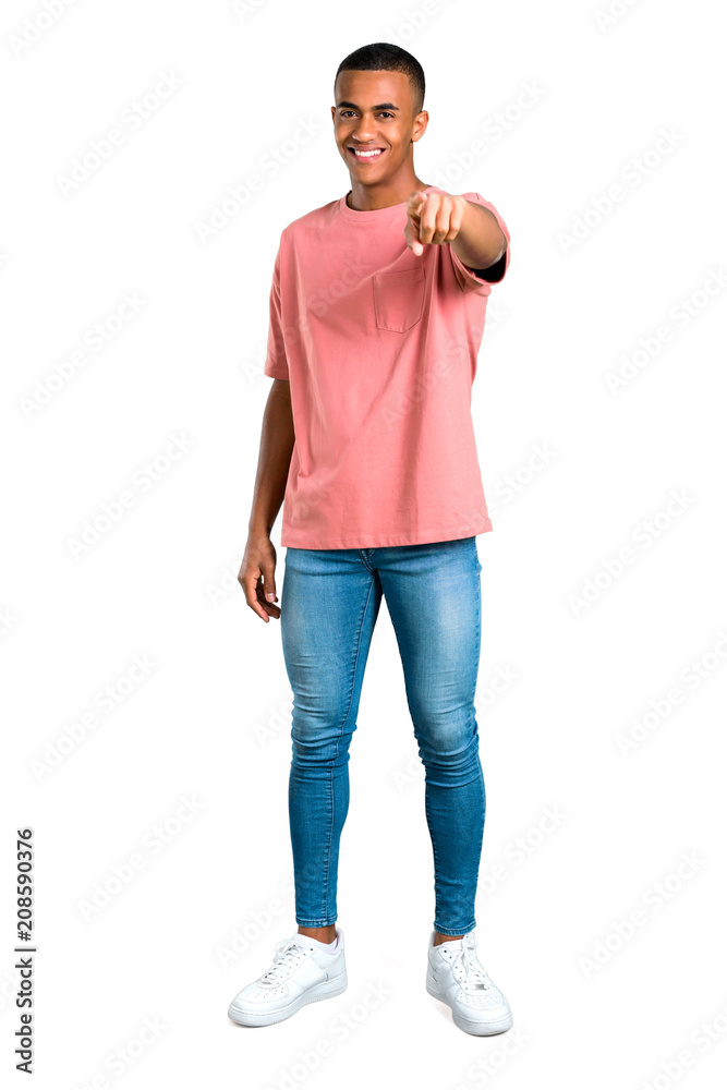 Fototapeta premium Standing young african american man points finger at you with a confident expression on isolated white background