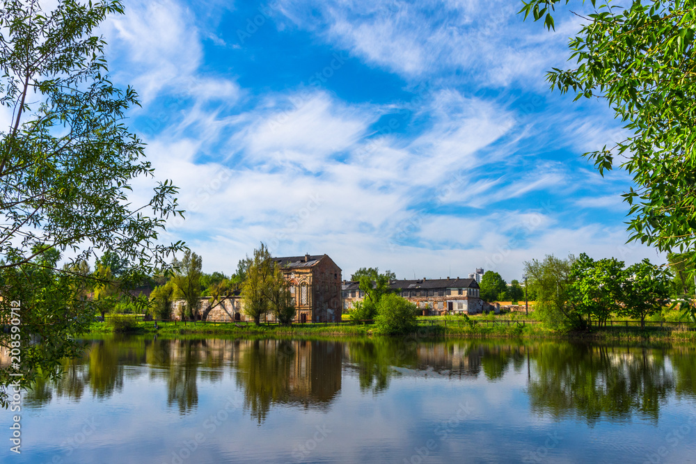 Fototapeta premium Minsk sity park in may day. Building reflection