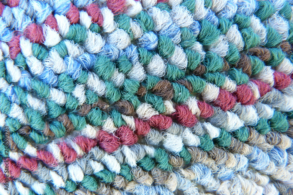 motley colored fabric boucle mohair cloth knitwear carpet close-up woolen thread scarf blue red gray green