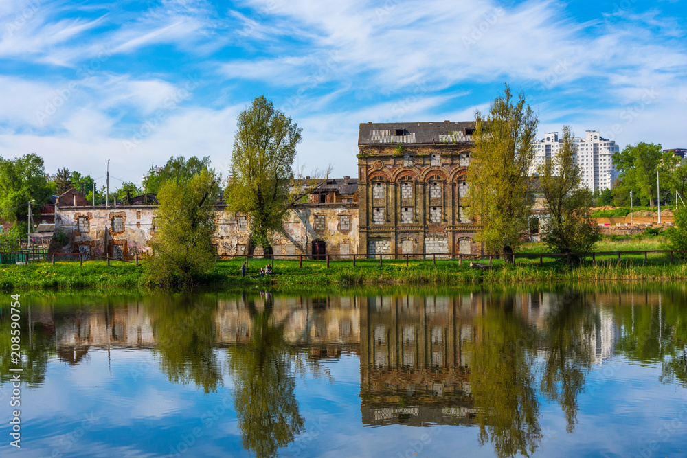 Minsk sity park in may day. Building reflection Minsk sity park in may day. Building reflection