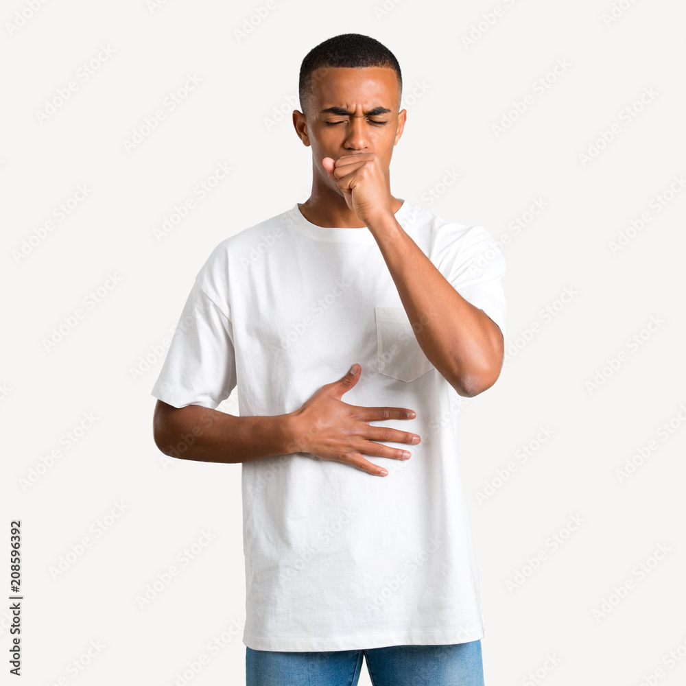 Young african american man is suffering with cough and feeling bad on isolated background Young african american man is suffering with cough and feeling bad on isolated background