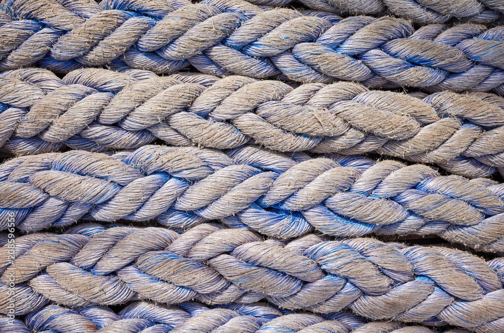 Close up picture ofold frayed boat ropes, abstract background or texture.