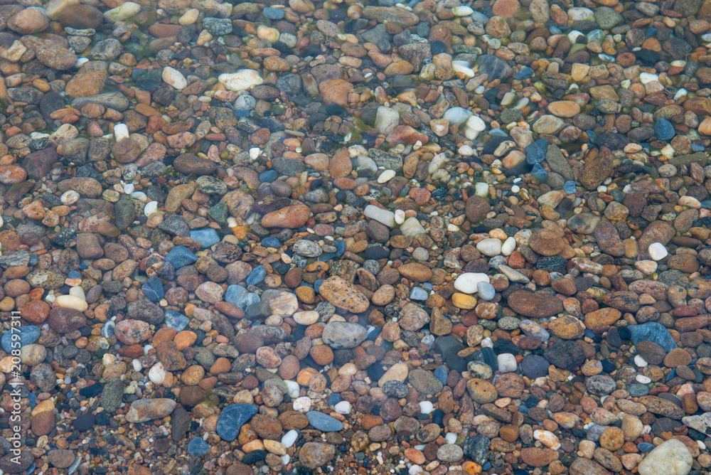 Colorful stones under the clear water of Lake Baikal, Russia.