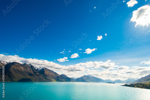 Beautiful landscape of Alps mountain and lake on a sunny day with blue sky.