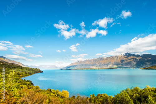 Beautiful landscape of Alps mountain and lake on a sunny day with blue sky.