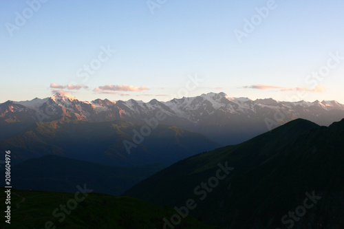 landscape with mountains and hills while sunset. The Svanetian range. © Elena