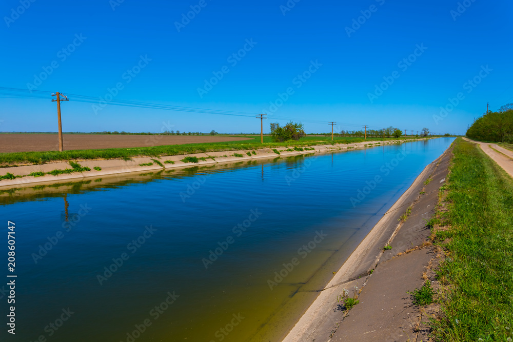 long irrigation channel among a prairies