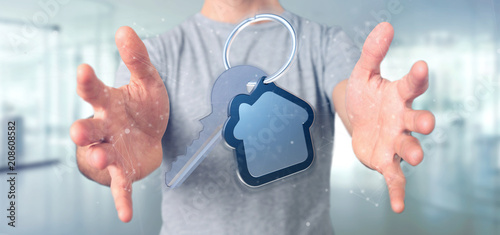 Man holding a Key and house 3d rendering