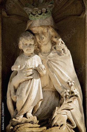 Fragment of ancient statue of the Virgin Mary with the baby Jesus Christ (Religion, faith, eternal life, God concept)