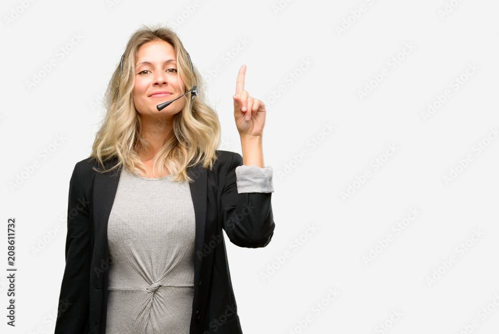 Young woman operator from call center raising finger, the number one Young woman operator from call center raising finger, the number one