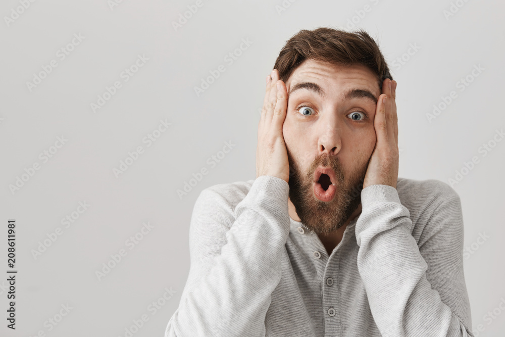 I can not believe you are so lucky, no way. Portrait of thrilled and shocked man with beard holding hands on head and saying wow while staring at camera, hearing awesome unbelievable news I can not believe you are so lucky, no way. Portrait of thrilled and shocked man with beard holding hands on head and saying wow while staring at camera, hearing awesome unbelievable news
