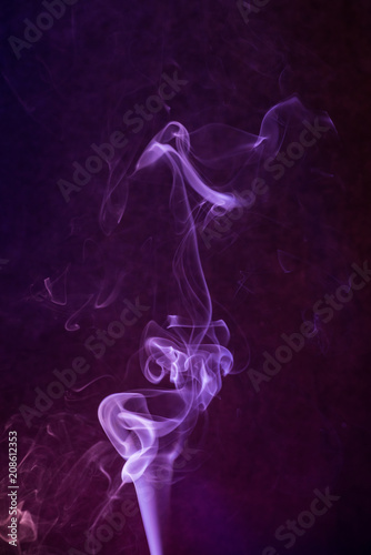Abstract fume swirls on colored background.