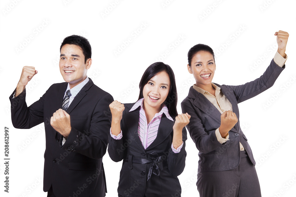 Business team celebrating their success on studio Business team celebrating their success on studio