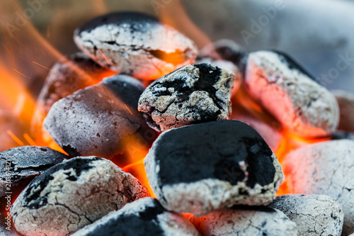 Картината върху платно Arranged coals (selective focus) ready for barbecue