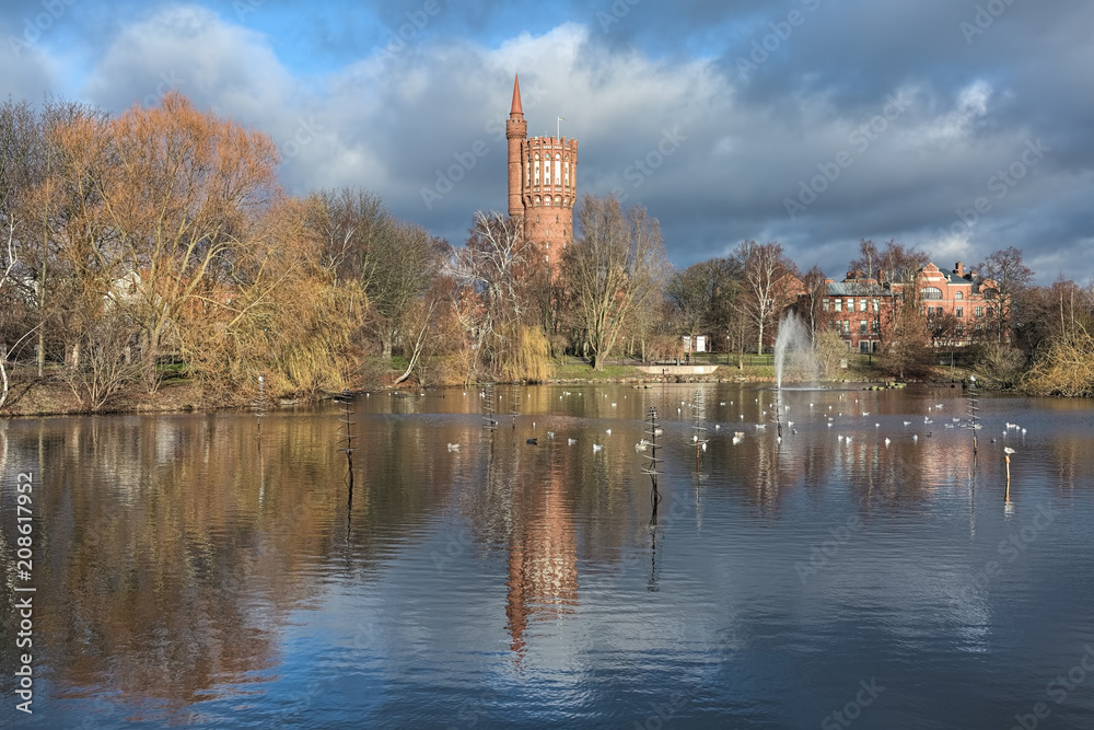 Landskrona, Sweden. View on Gamla Vattentornet (Old water tower) from St Olaf lake in late autumn. The water tower was built in 1904 and used for its intended purpose until 1975. Landskrona, Sweden. View on Gamla Vattentornet (Old water tower) from St Olaf lake in late autumn. The water tower was built in 1904 and used for its intended purpose until 1975.