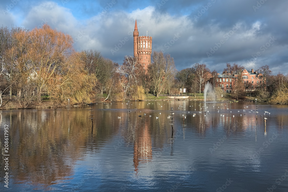 Landskrona, Sweden. View on Gamla Vattentornet (Old water tower) from St Olaf lake in late autumn. The water tower was built in 1904 and used for its intended purpose until 1975.