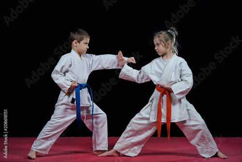 Children are training karate blows
