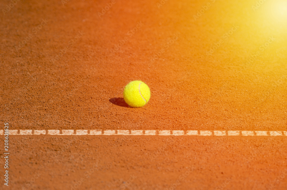 tennis ball on the court orange and net background for design