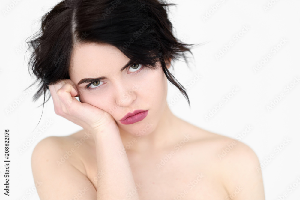 emotion face. bored fed up unimpressed apathetic woman. young beautiful brunette girl portrait on white background.