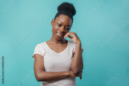 Fotografija nice pleasant Afro woman remembers her happy childhood and neighborhood