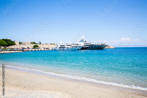 Sand beach and modern yachts in Rhodes Town, Rhodes Island, Mediterranean Sea, Greece © traveller70