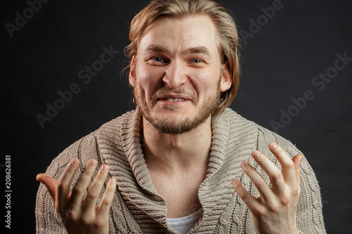 close up image of blond big man proving his idea with gestures. convince people