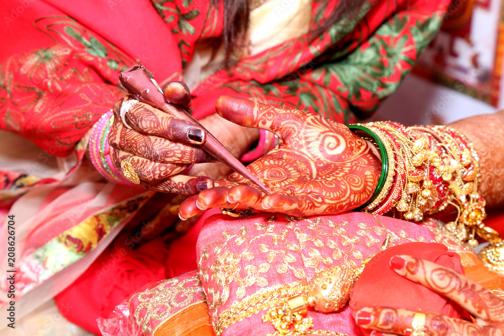 Application of henna as skin decoration in Indian Wedding, Wedding at the indian ceremony