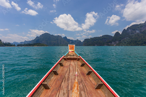 wooden longtail boat trip adventure at Ratchaprapa dam, Thailand © oh_hyyo