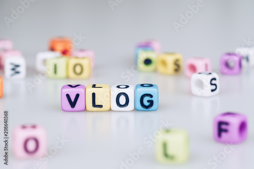 VLOG word text written on colorful cube with bokeh cube word block background