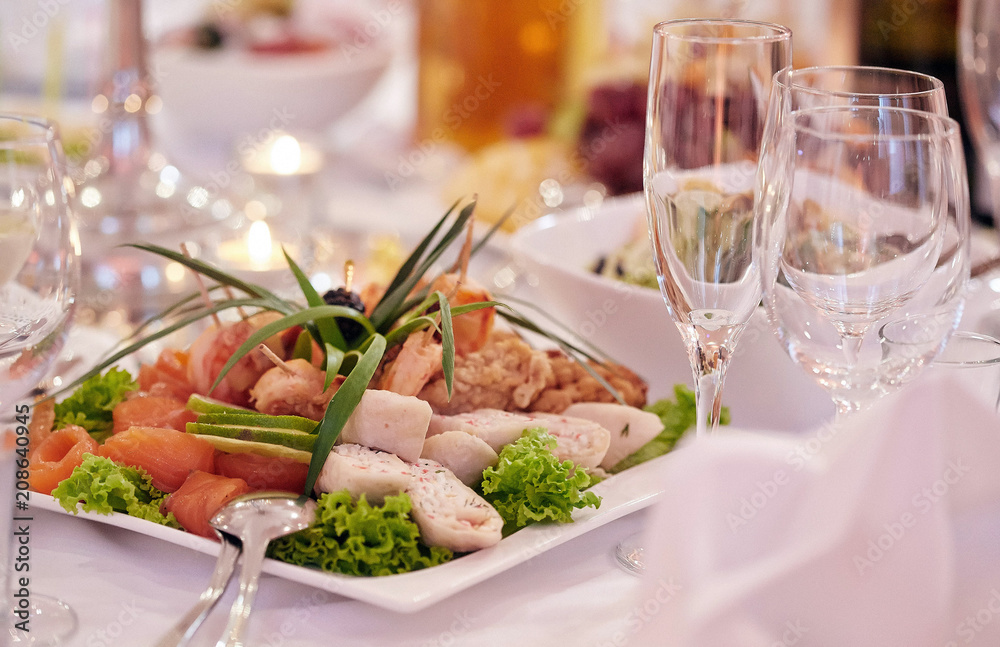 Close-up image of a festive table with different dishes. Close-up image of a festive table with different dishes.