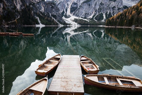 Wooden boat at the alpine mountain lake