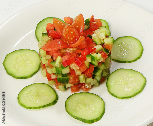 Children's salad (cucumbers, tomatoes, bell pepper, greens)