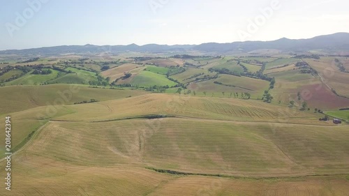 Vista aerea di un bellissimo paesaggio collinare con immensi prati e dune. Val D'Orcia in Toscana  photo