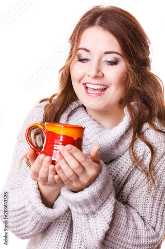 Woman holding red tea coffee mug