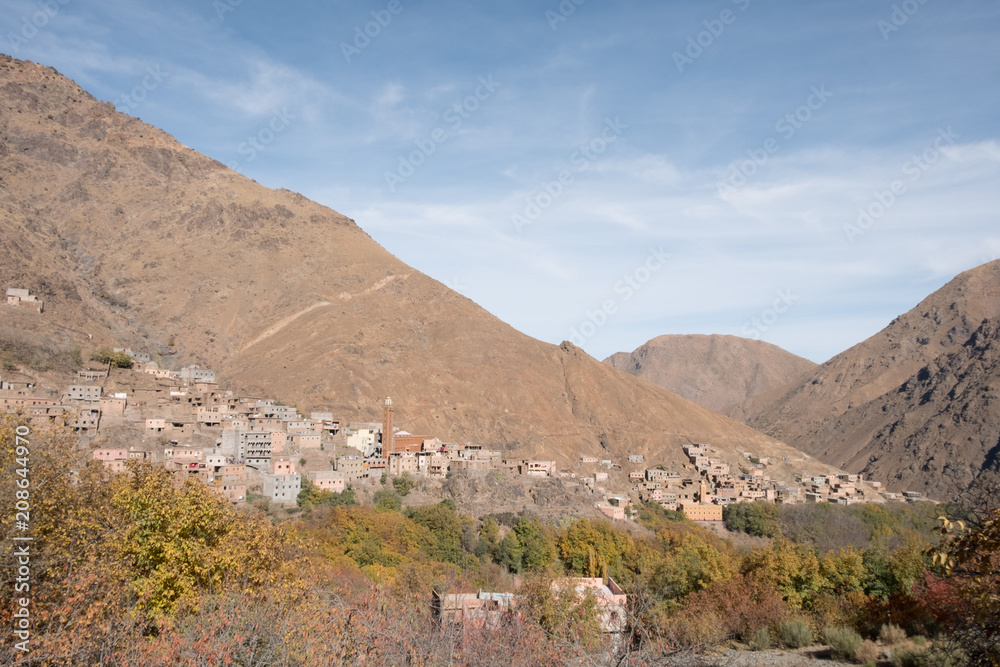 Morocco, Imlil: photo of old town in sandy mountains in hot summer with blue sky