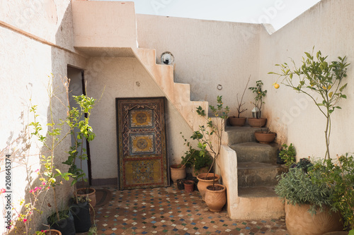 old house with painted door and stairs in Morocco