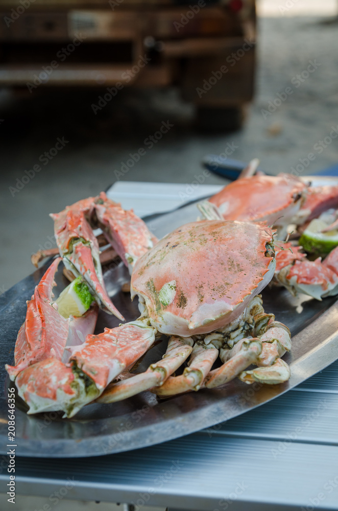 Giant grilled crab served at small beach restaurant at Tokeh Beach, Sierra Leone, Africa Giant grilled crab served at small beach restaurant at Tokeh Beach, Sierra Leone, Africa