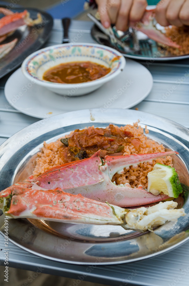 Giant grilled crab served at small beach restaurant at Tokeh Beach, Sierra Leone, Africa Giant grilled crab served at small beach restaurant at Tokeh Beach, Sierra Leone, Africa