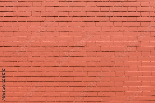Strong red vertical brick wall background, surface. Red, orange tiles