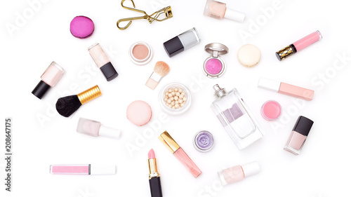 Decorative cosmetics of pink color on a white background. Flat lay