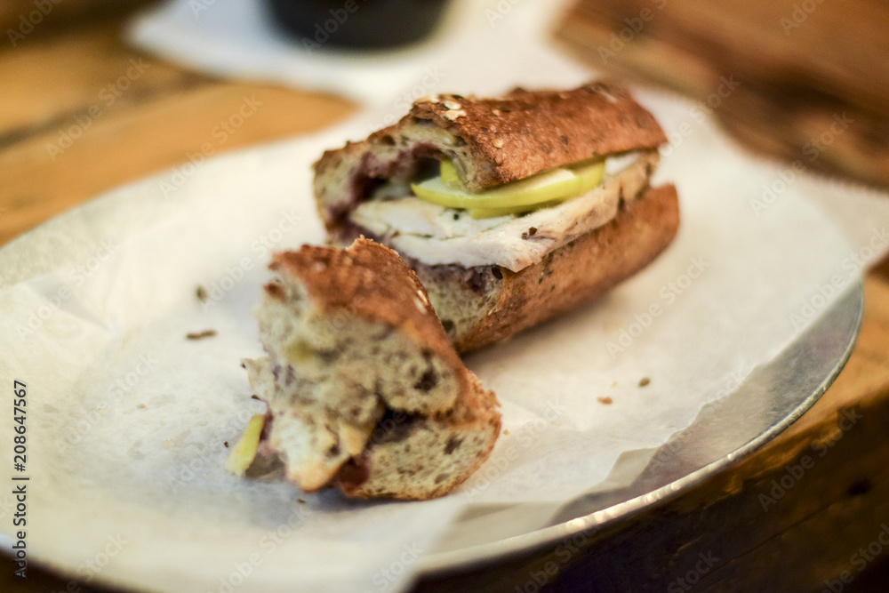 Half of a chicken apple and brie sandwich Half of a chicken apple and brie sandwich