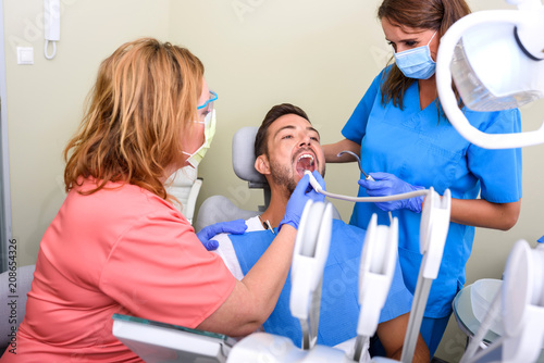 A patient getting treatment in a dental studio 