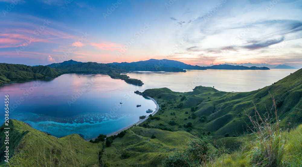 A panoramic view from the top view of 'Gili Lawa' after sunset, Komodo Island (Komodo National Park), Labuan Bajo, Flores, Indonesia A panoramic view from the top view of 'Gili Lawa' after sunset, Komodo Island (Komodo National Park), Labuan Bajo, Flores, Indonesia